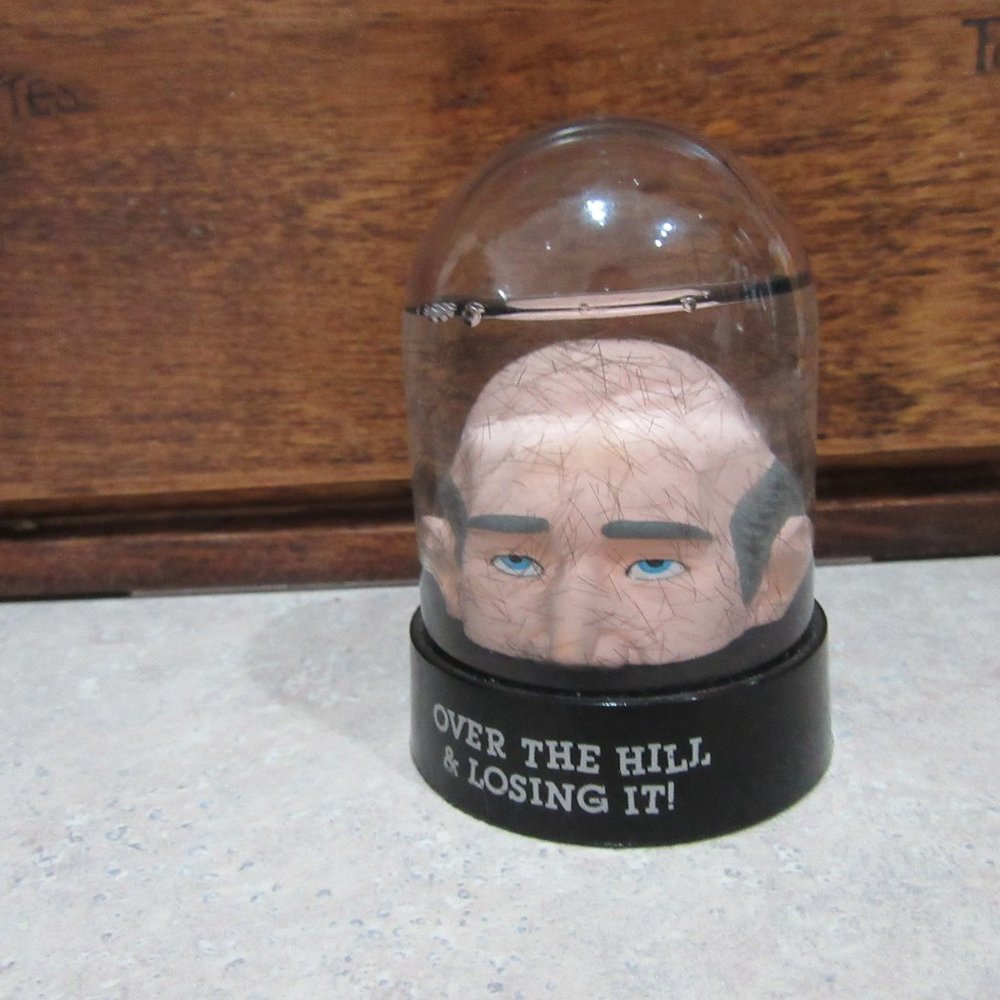 Bald man in liquid Over The Hill & Losing It